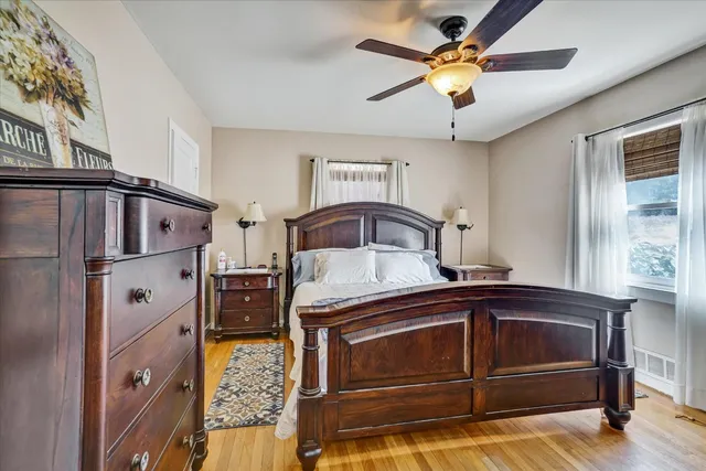 a utility room with stainless steel appliances a sink and a refrigerator
