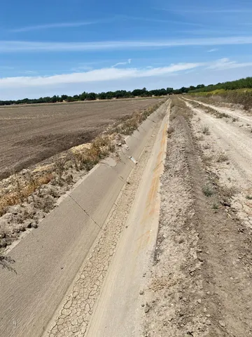 a view of a lake with a yard