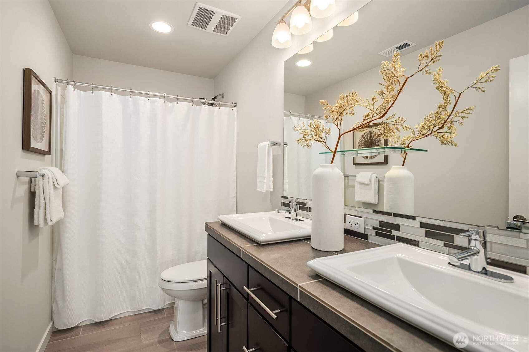 16911 125th Street Southeast Snohomish, WA 98290 - Photo 19 of 29 a bathroom with double vanity sink a toilet and a mirror