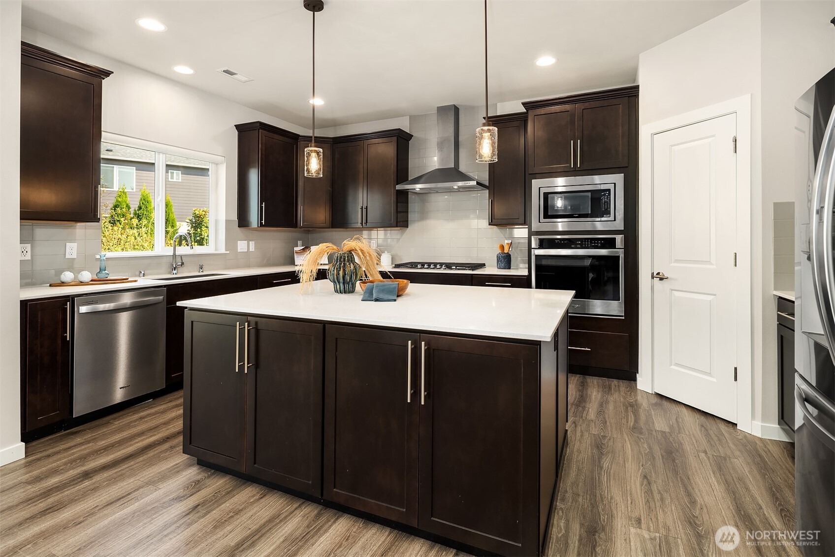 16911 125th Street Southeast Snohomish, WA 98290 - Photo 5 of 29 a kitchen with stainless steel appliances a sink stove and refrigerator