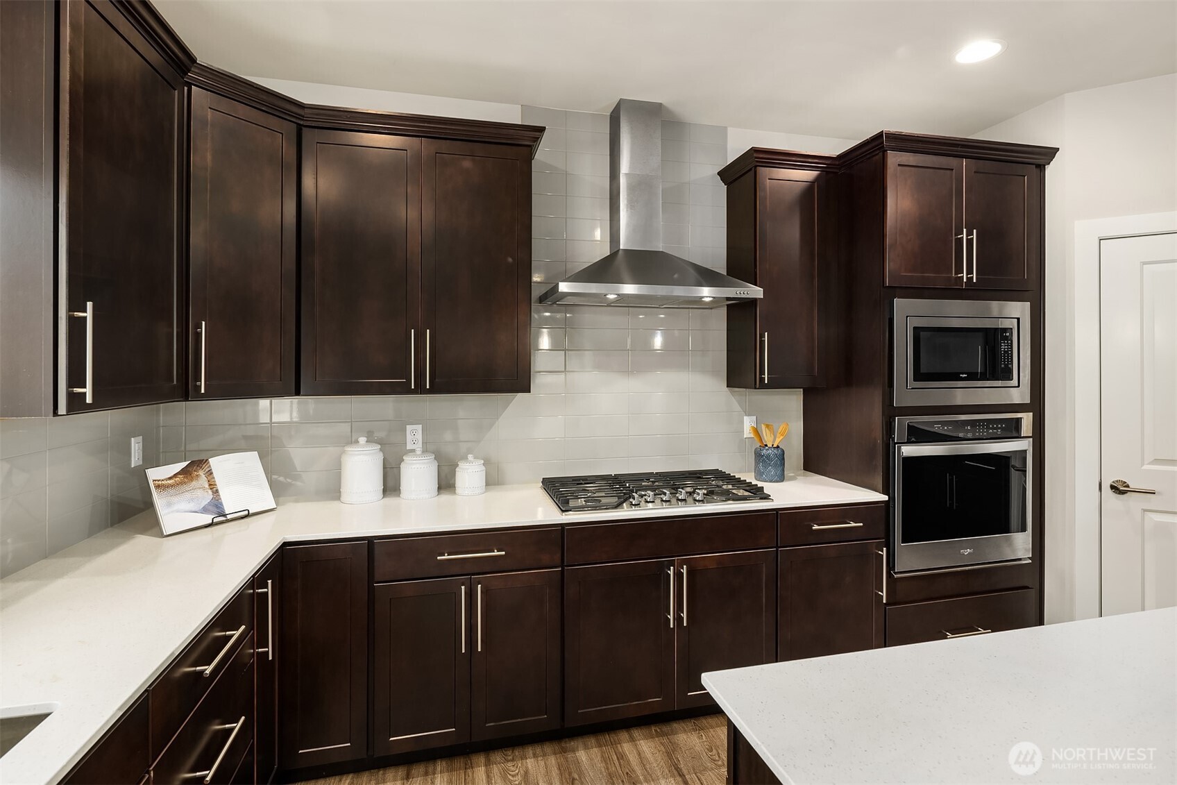 16911 125th Street Southeast Snohomish, WA 98290 - Photo 6 of 29 a kitchen with stainless steel appliances a stove a refrigerator and cabinets