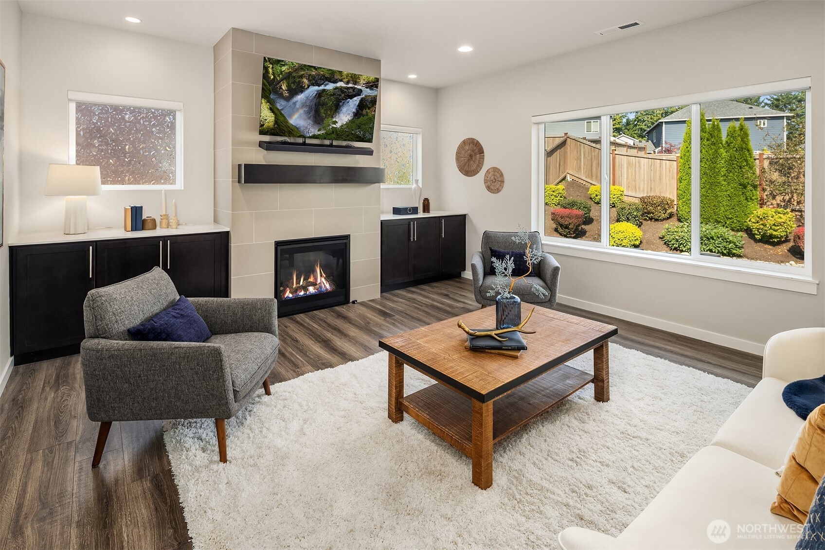 16911 125th Street Southeast Snohomish, WA 98290 - Photo 8 of 29 a living room with furniture a large window and a fireplace