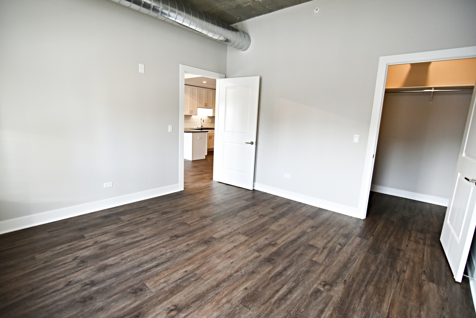 3833 North Broadway, Unit 720 Chicago, IL 60613 - Photo 9 of 11 a view of a room with wooden floor