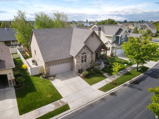 882 Sego Lily Way Mapleton, UT 84664 - Photo 35 of 41 Stone and stucco exterior with an arched window accent