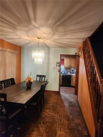 a kitchen with a table and chairs in it