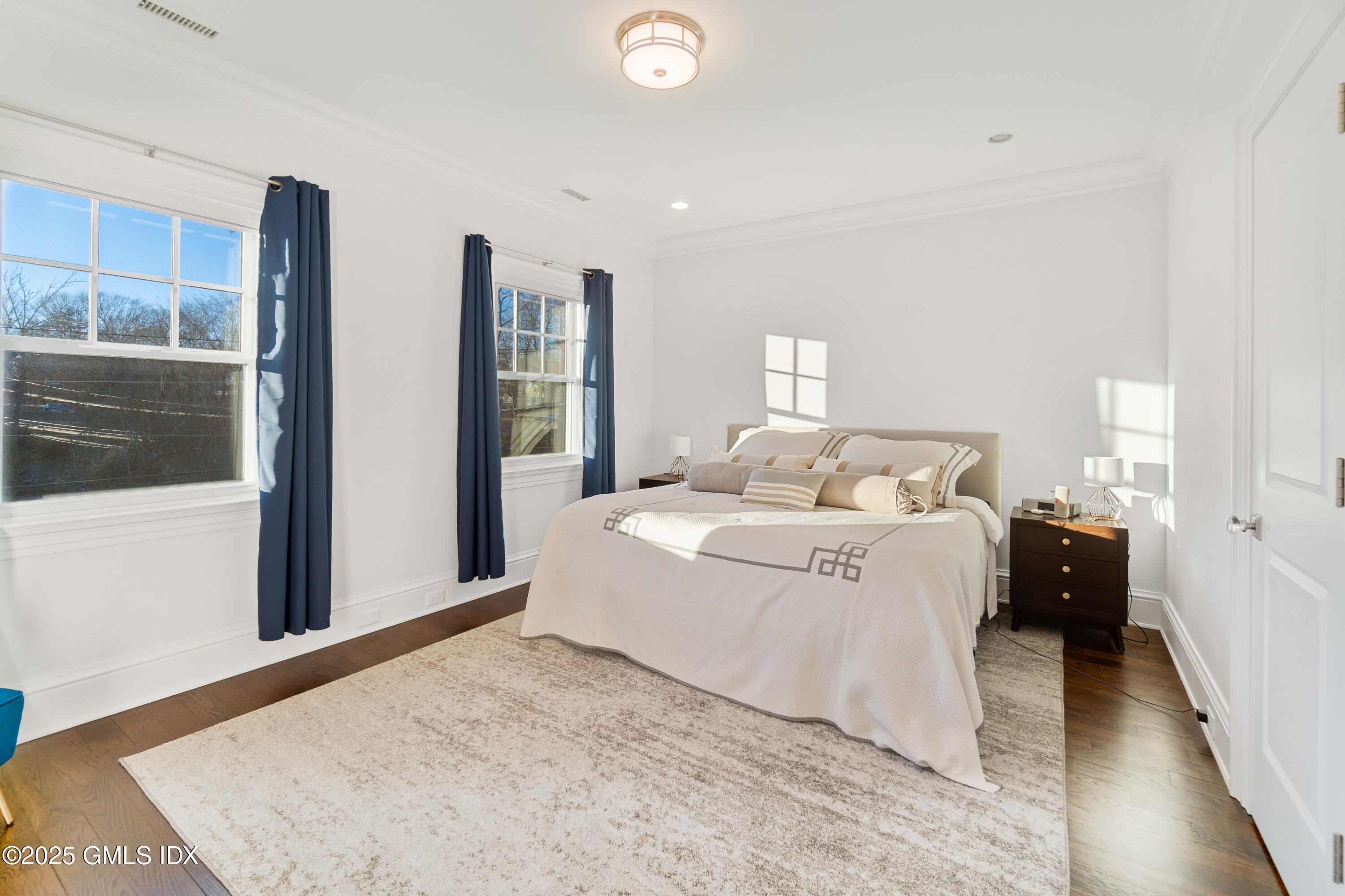 3 Orchard Place, Unit A Greenwich, CT 06830 - Photo 17 of 19 a large white bed in a white room