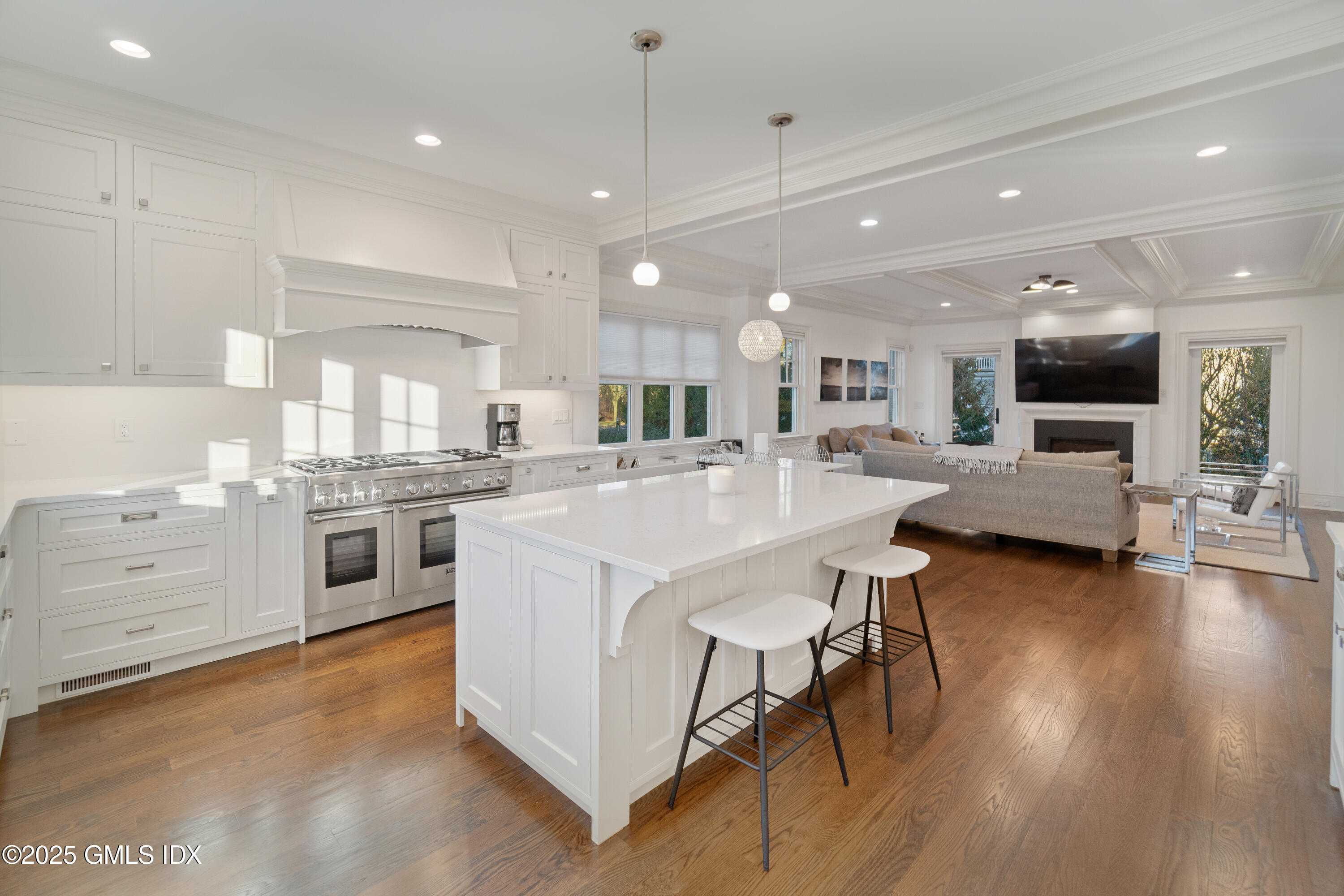 3 Orchard Place, Unit A Greenwich, CT 06830 - Photo 9 of 19 a large white kitchen with lots of counter space a sink and appliances