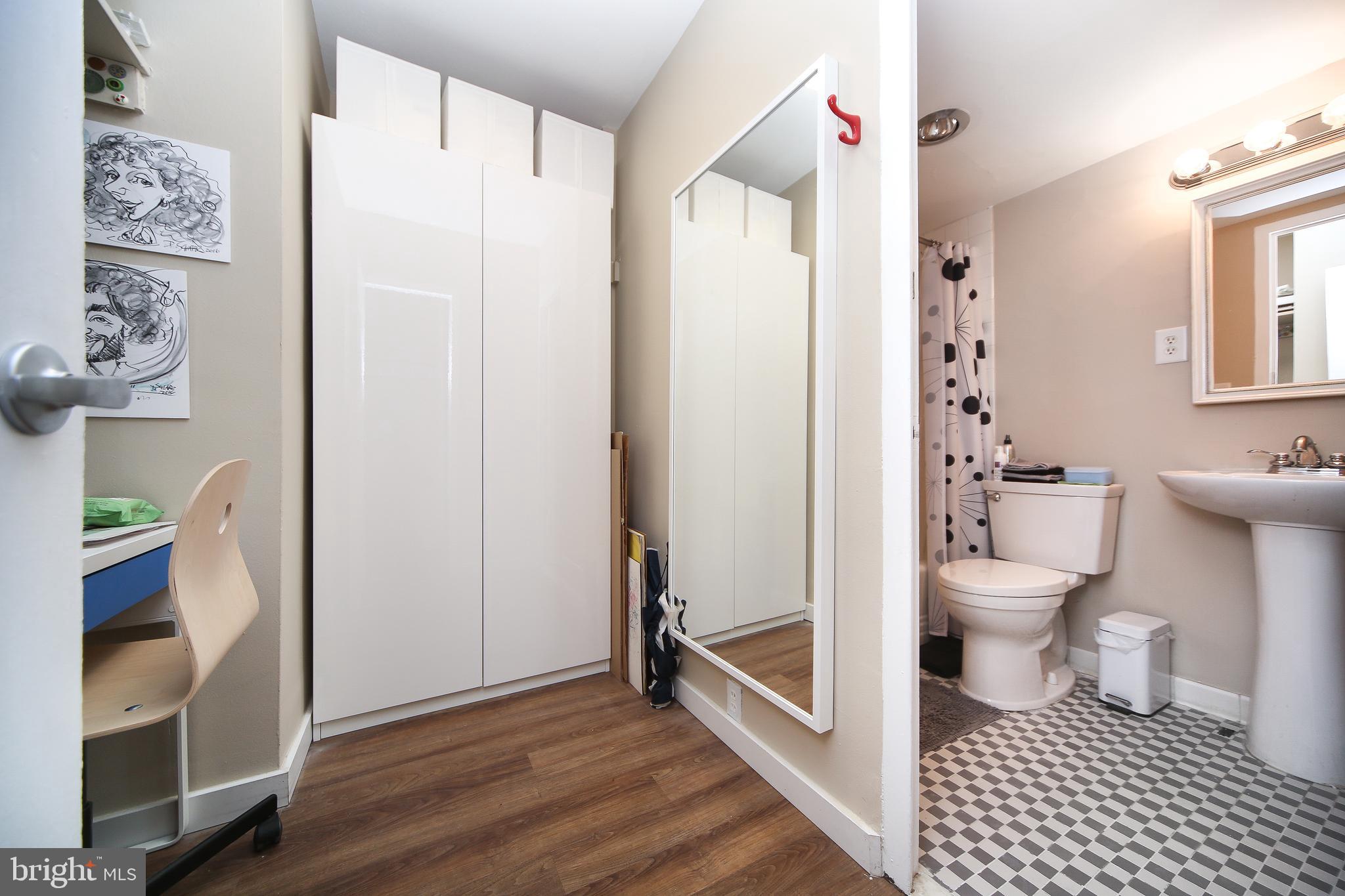 210 Locust Street, Unit 21E Philadelphia, PA 19106 - Photo 17 of 51 a bathroom with a toilet and a shower