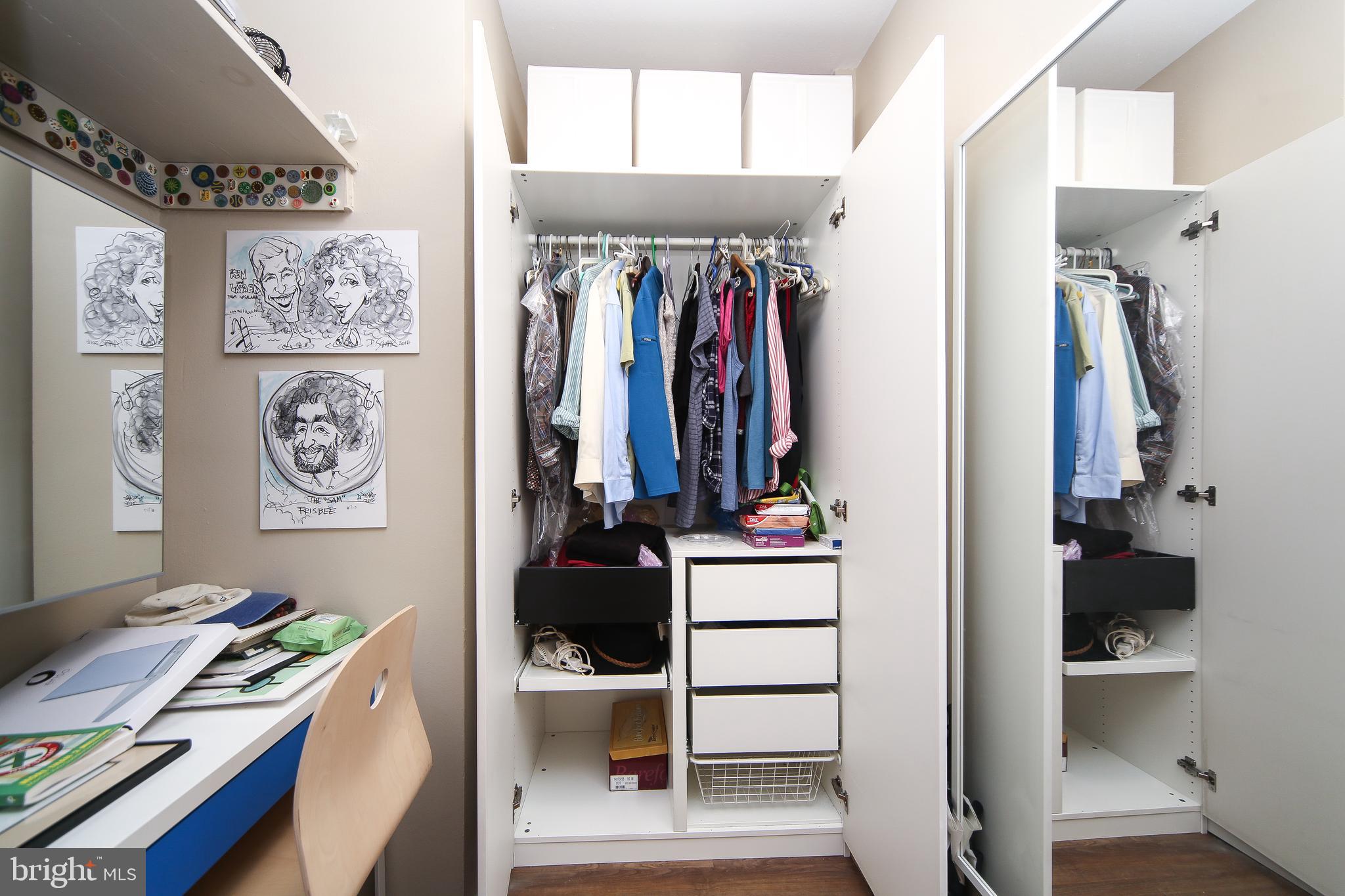 210 Locust Street, Unit 21E Philadelphia, PA 19106 - Photo 18 of 51 a view of walk in closet with clothes and shoes