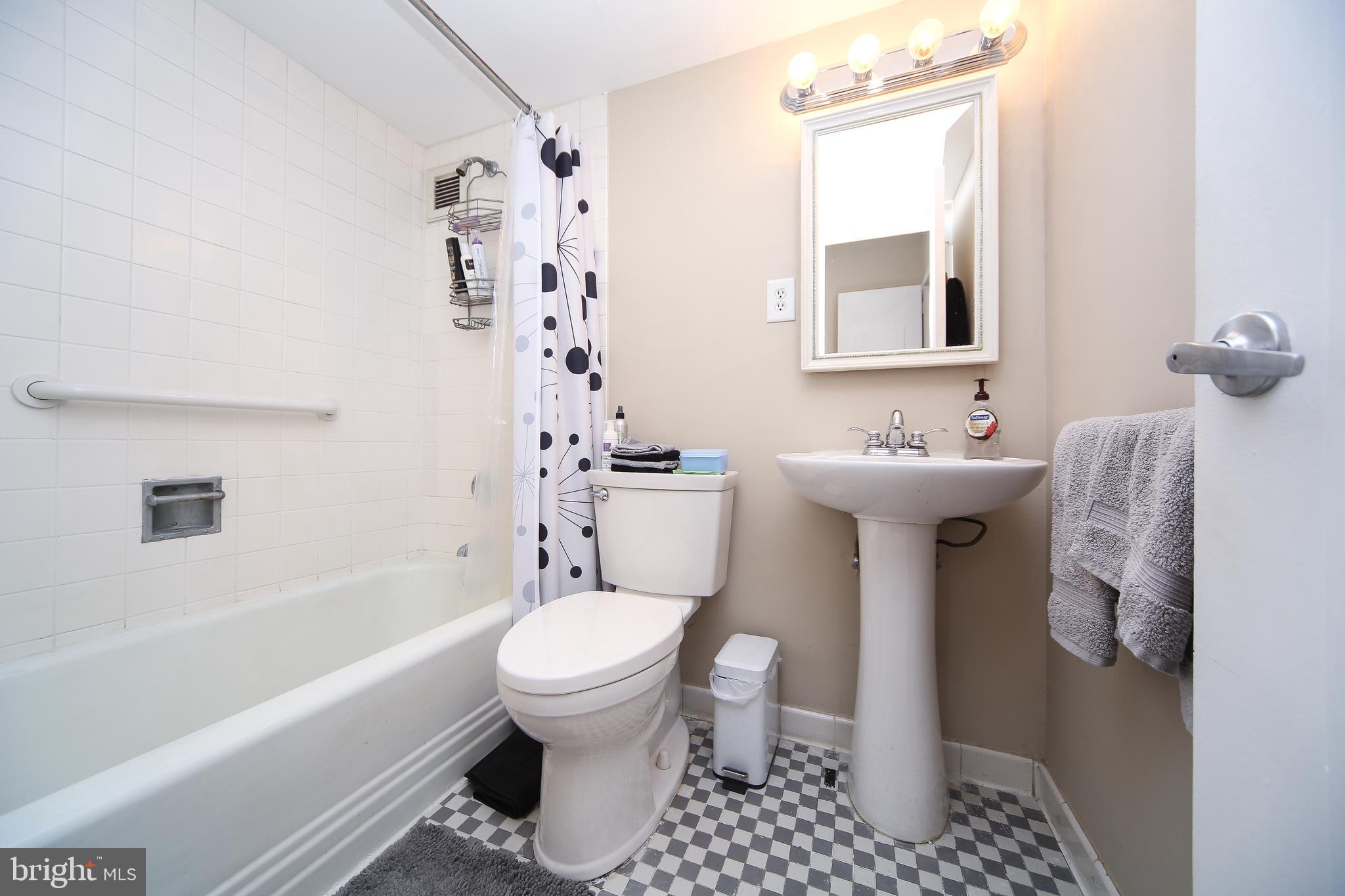 210 Locust Street, Unit 21E Philadelphia, PA 19106 - Photo 19 of 51 a bathroom with a sink toilet and shower