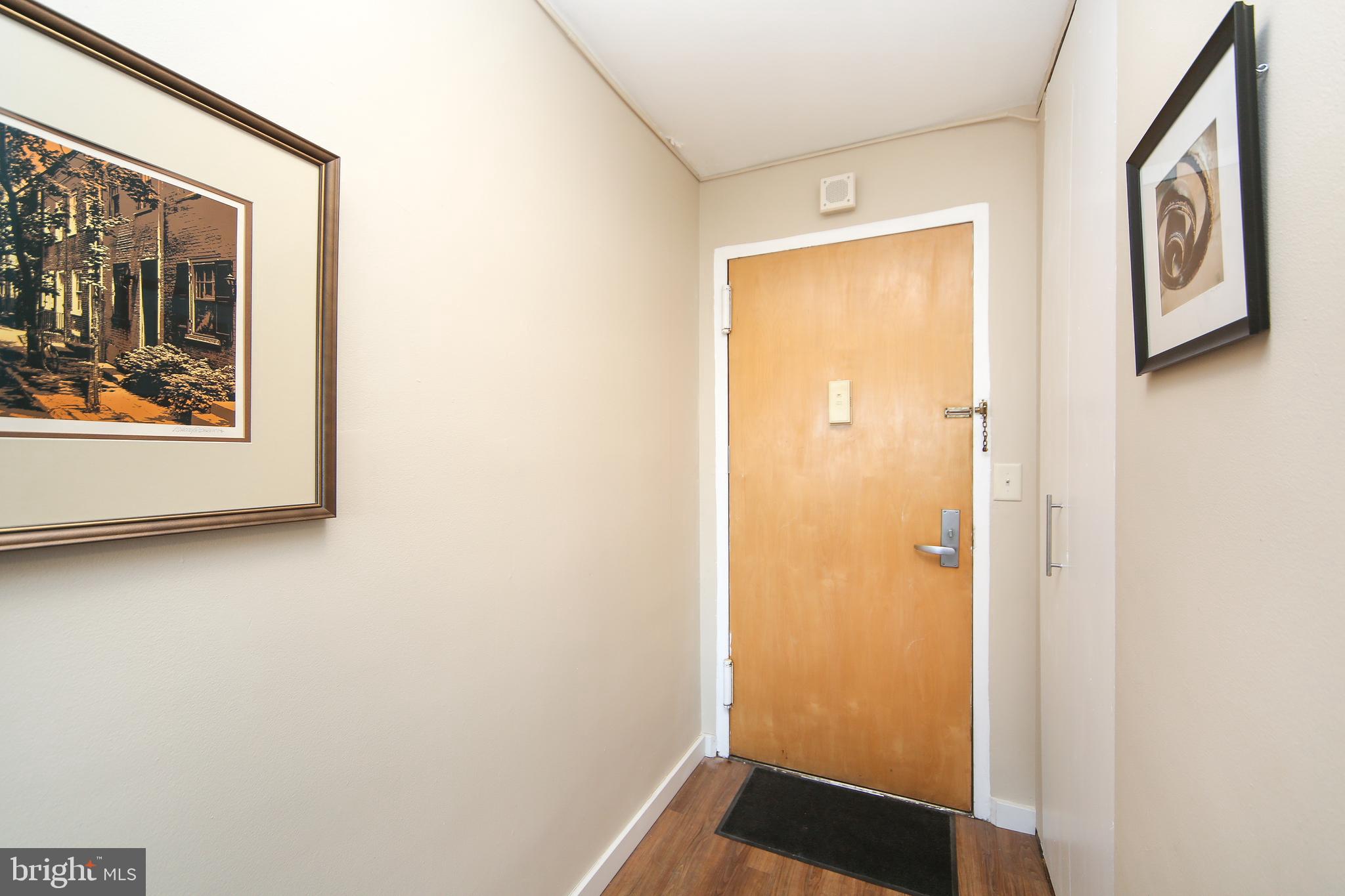 210 Locust Street, Unit 21E Philadelphia, PA 19106 - Photo 2 of 51 a view of front door with wooden floor