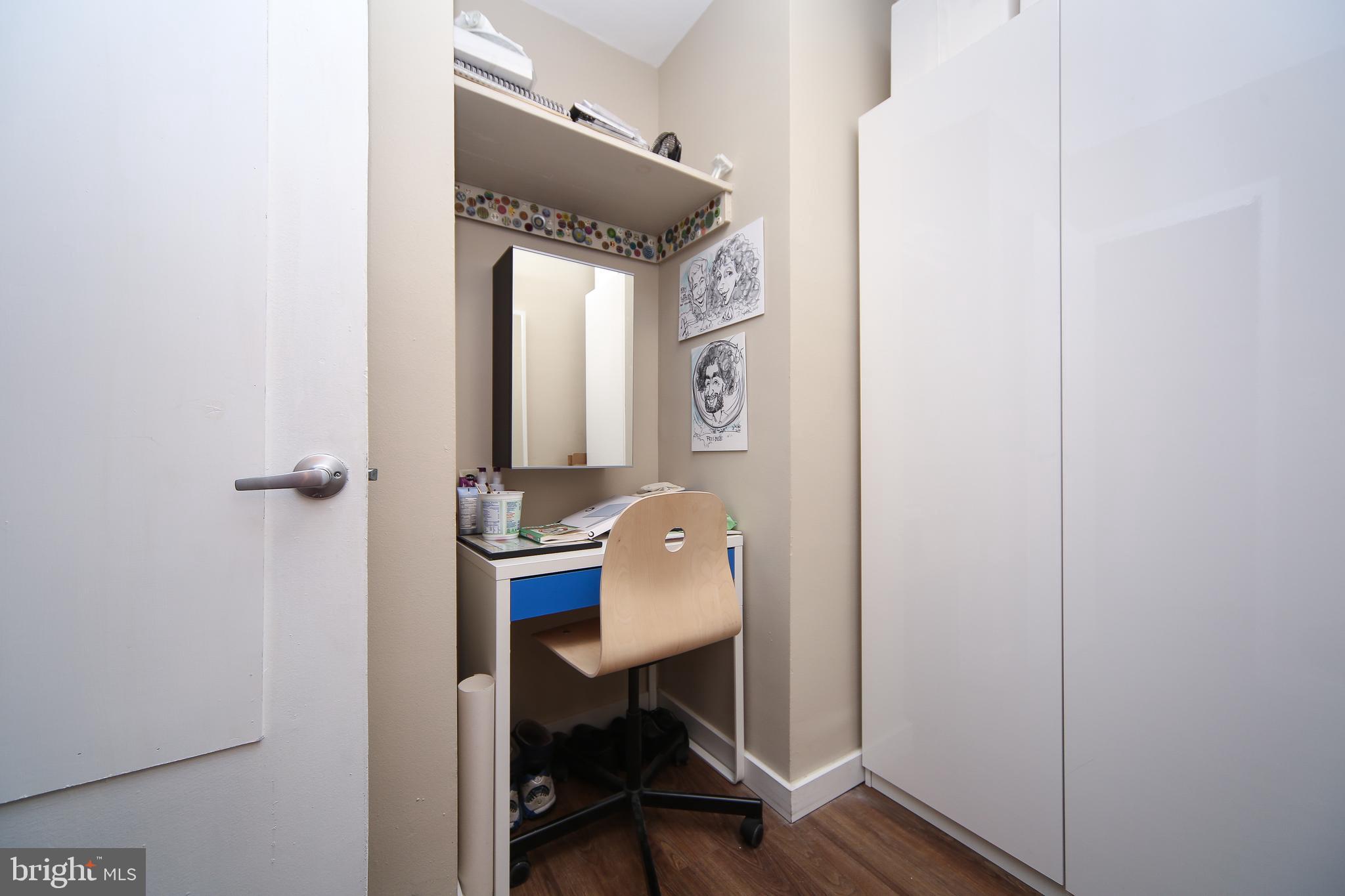 210 Locust Street, Unit 21E Philadelphia, PA 19106 - Photo 21 of 51 a view of workspace with wooden floor and windows