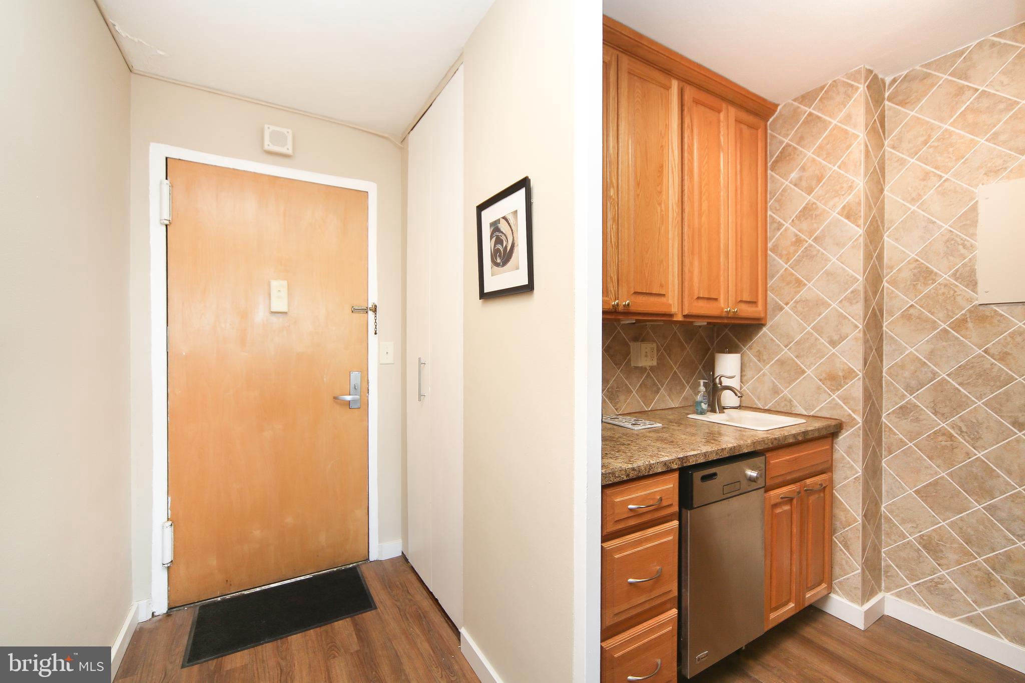210 Locust Street, Unit 21E Philadelphia, PA 19106 - Photo 3 of 51 a bathroom with a granite countertop sink a mirror and a shower