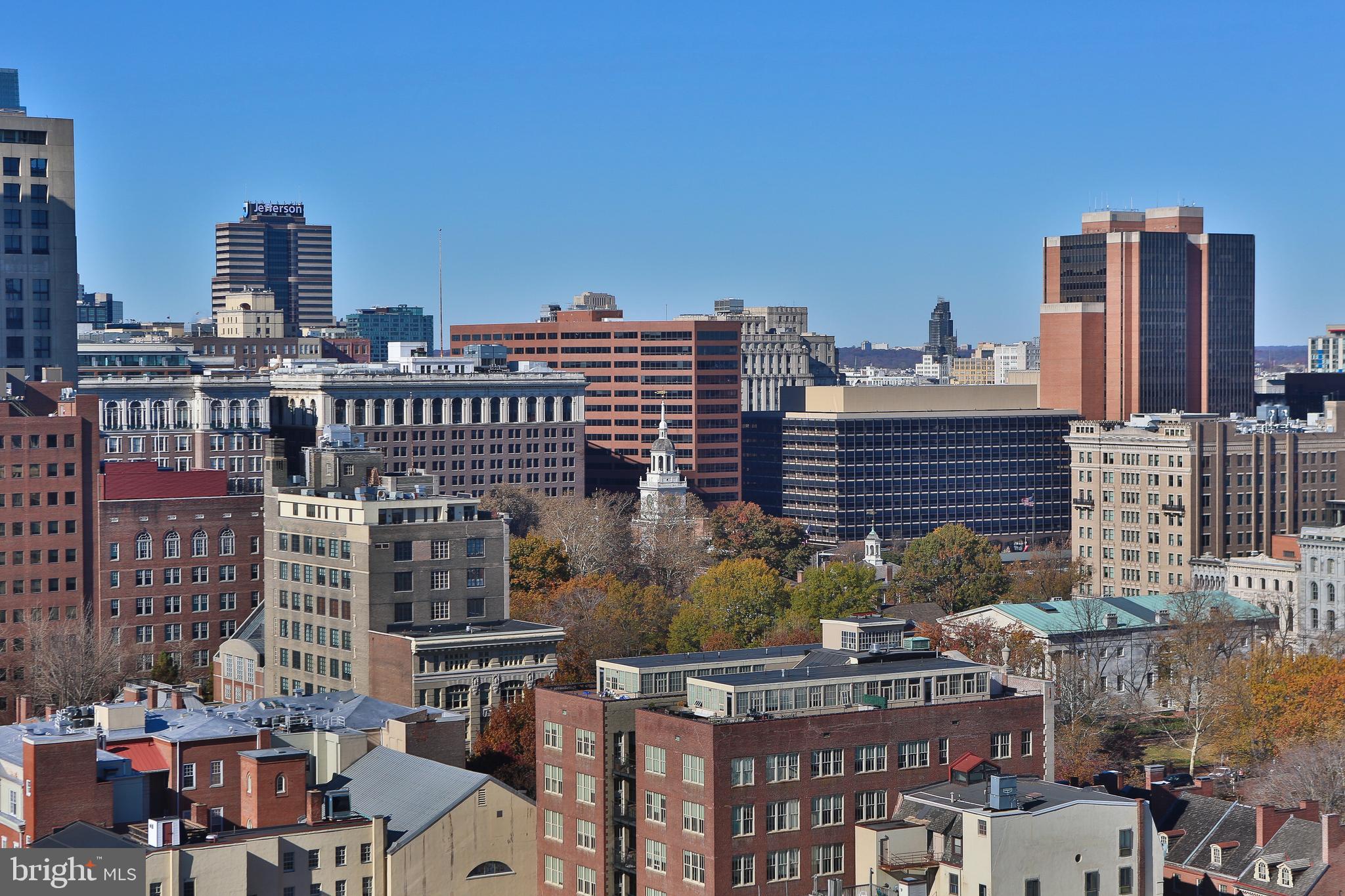 210 Locust Street, Unit 21E Philadelphia, PA 19106 - Photo 10 of 51 a view of a city with tall buildings