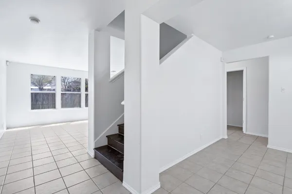 a view of an empty room and glass door