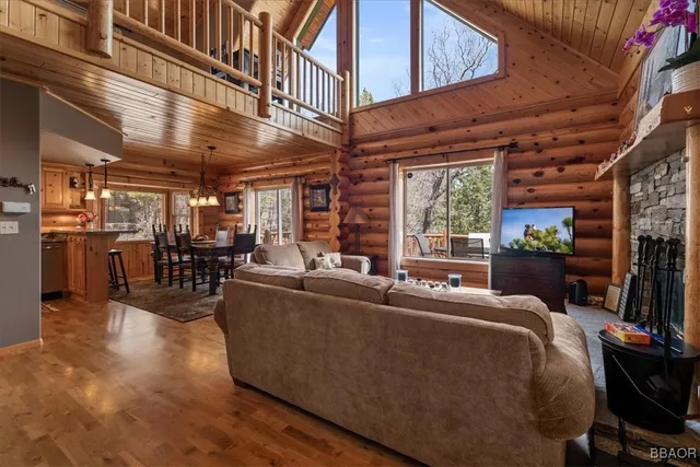 a living room with furniture and a ceiling fan