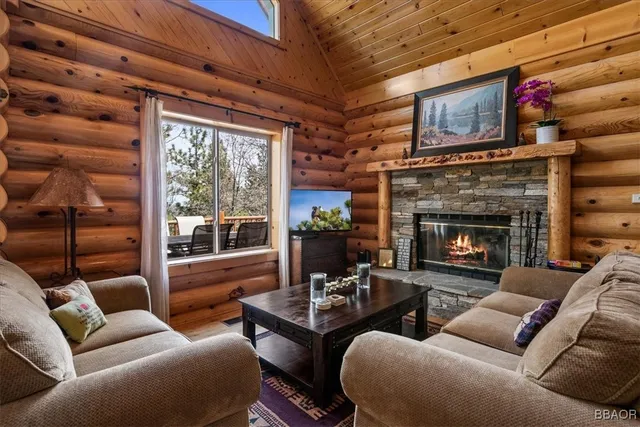 a view of a dining room with furniture large windows and wooden floor