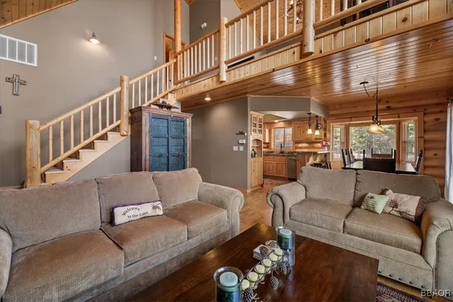a kitchen with stainless steel appliances granite countertop a sink stove and microwave