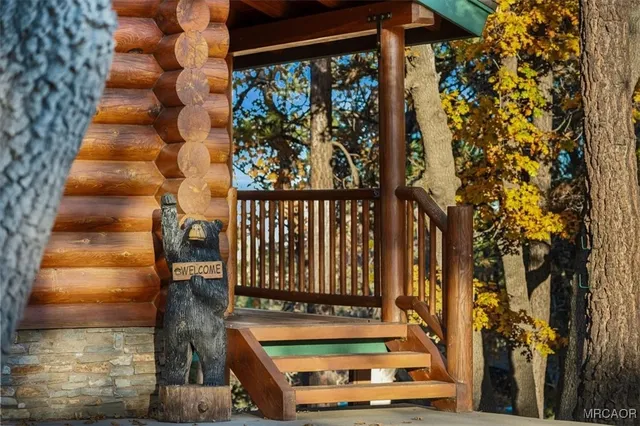 a house with wooden floor in front of it