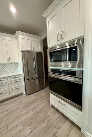 a work room with furniture and a window