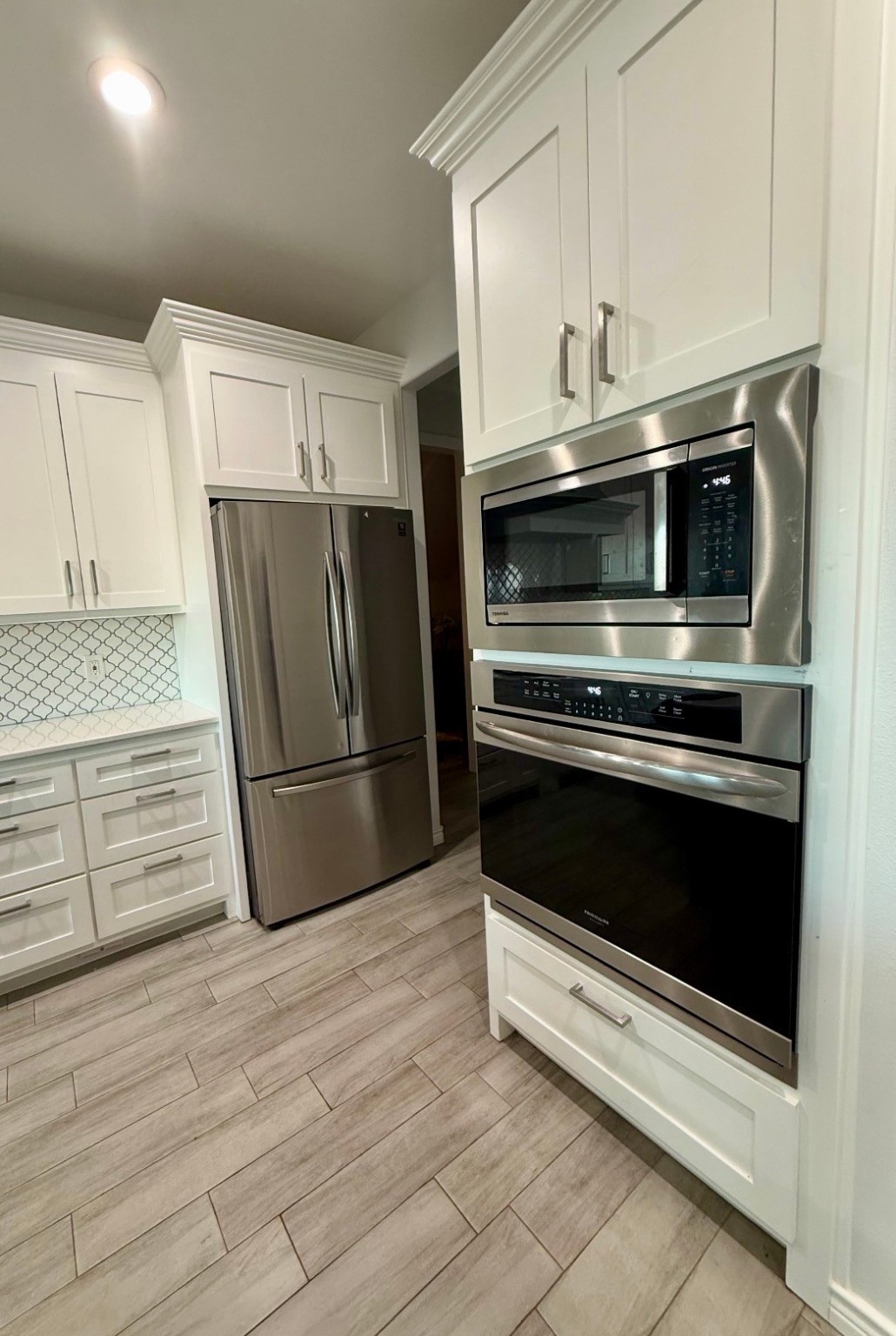 2295 Diamond D Lane Beaumont, TX 77713 - Photo 11 of 28 a kitchen with granite countertop white cabinets and stainless steel appliances