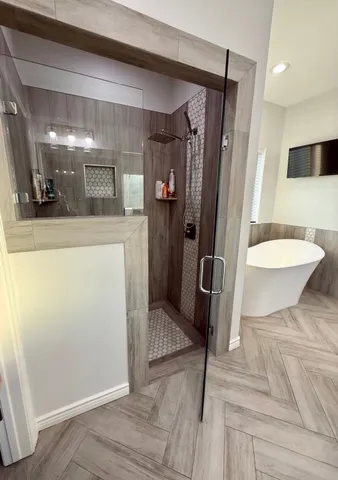 a bathroom with a tub and a sink