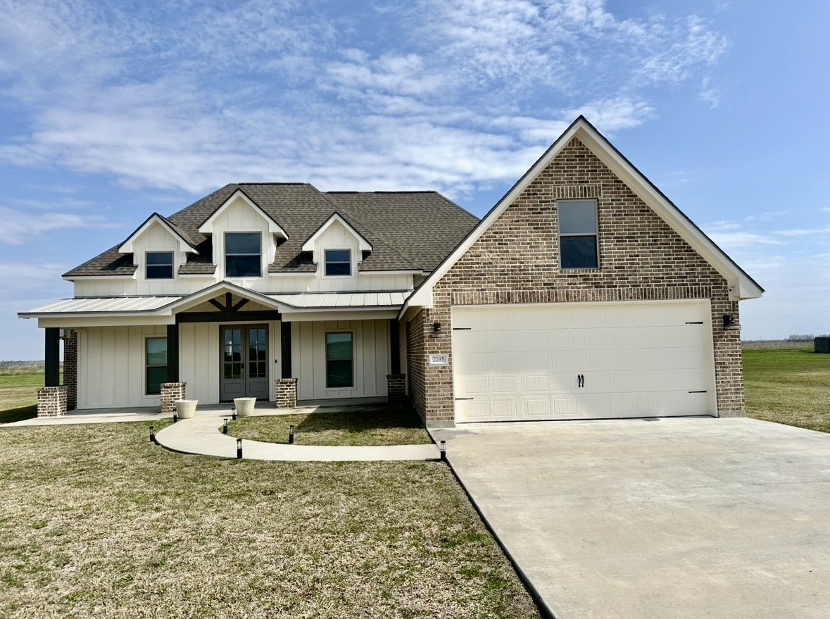 2295 Diamond D Lane Beaumont, TX 77713 - Photo 2 of 28 a front view of a house with a yard