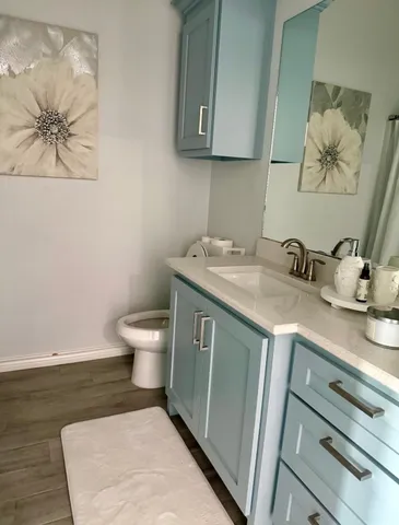 a bathroom with a toilet and a tub