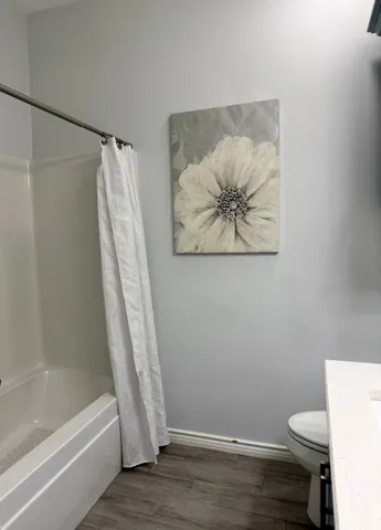 a room with furniture and a rug