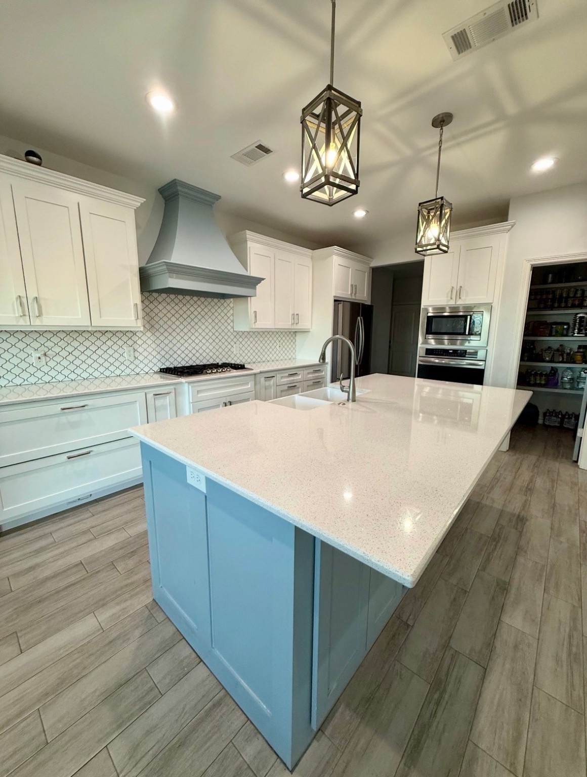 2295 Diamond D Lane Beaumont, TX 77713 - Photo 10 of 28 a kitchen with stainless steel appliances granite countertop a sink a stove and a wooden floors