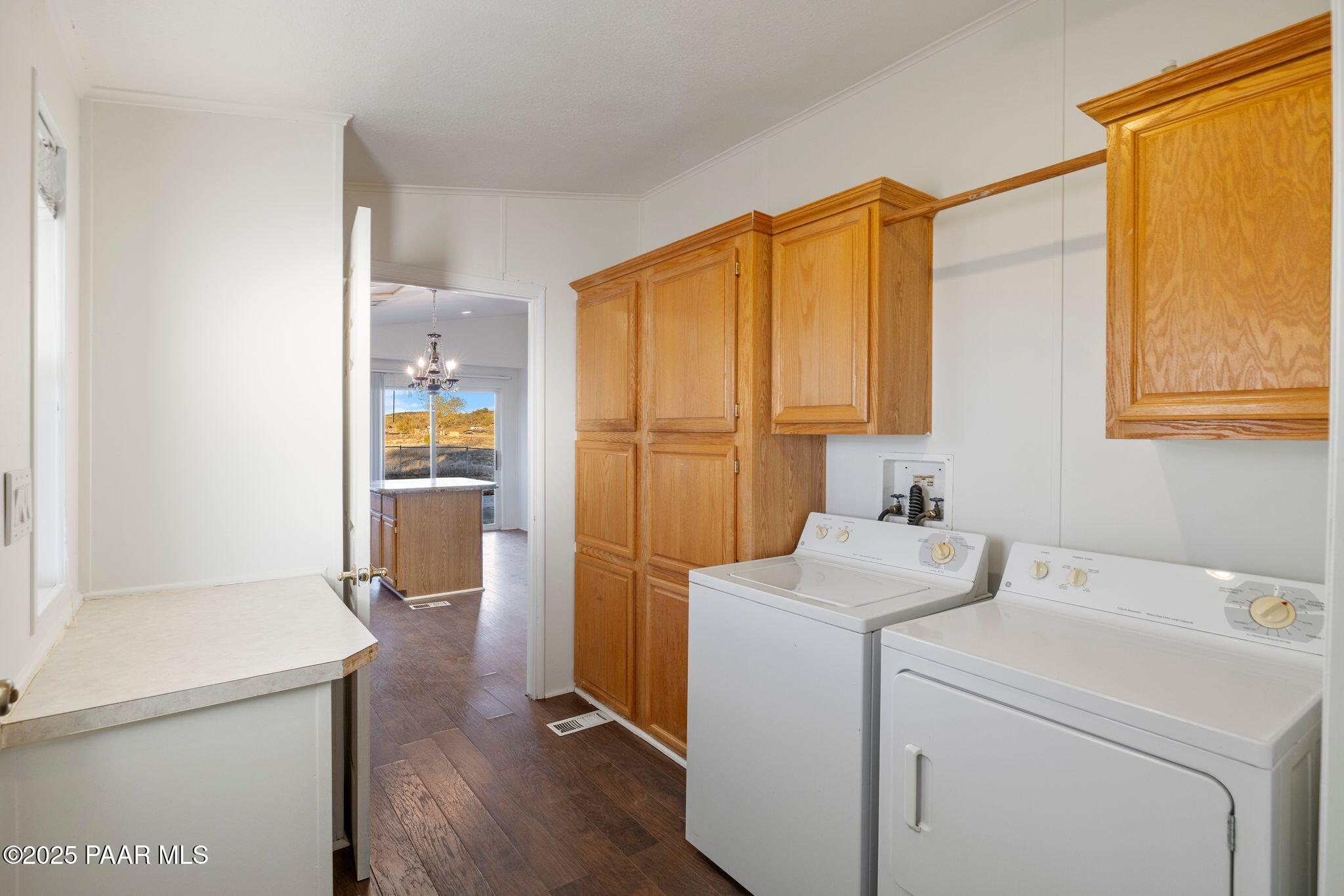 24580 North St Louis Street Paulden, AZ 86334 - Photo 11 of 26 a bathroom with a sink a washer and dryer