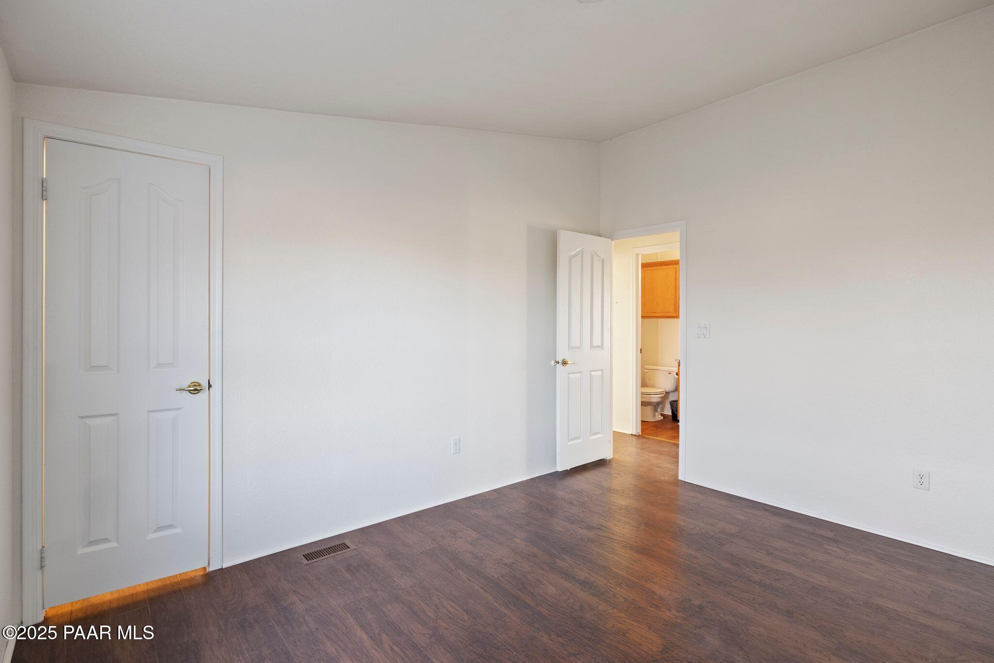 24580 North St Louis Street Paulden, AZ 86334 - Photo 16 of 26 a view of an empty room with wooden floor and closet