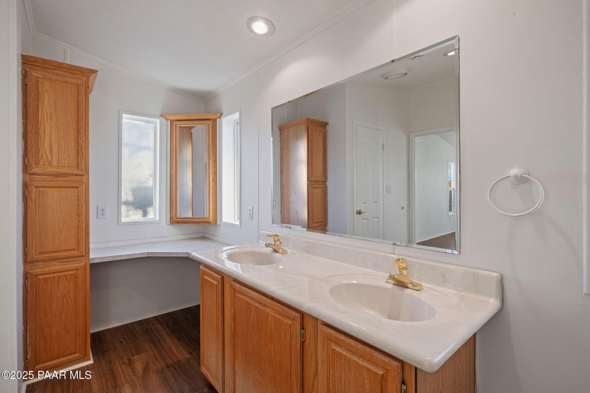 24580 North St Louis Street Paulden, AZ 86334 - Photo 21 of 26 a bathroom with a sink and a mirror