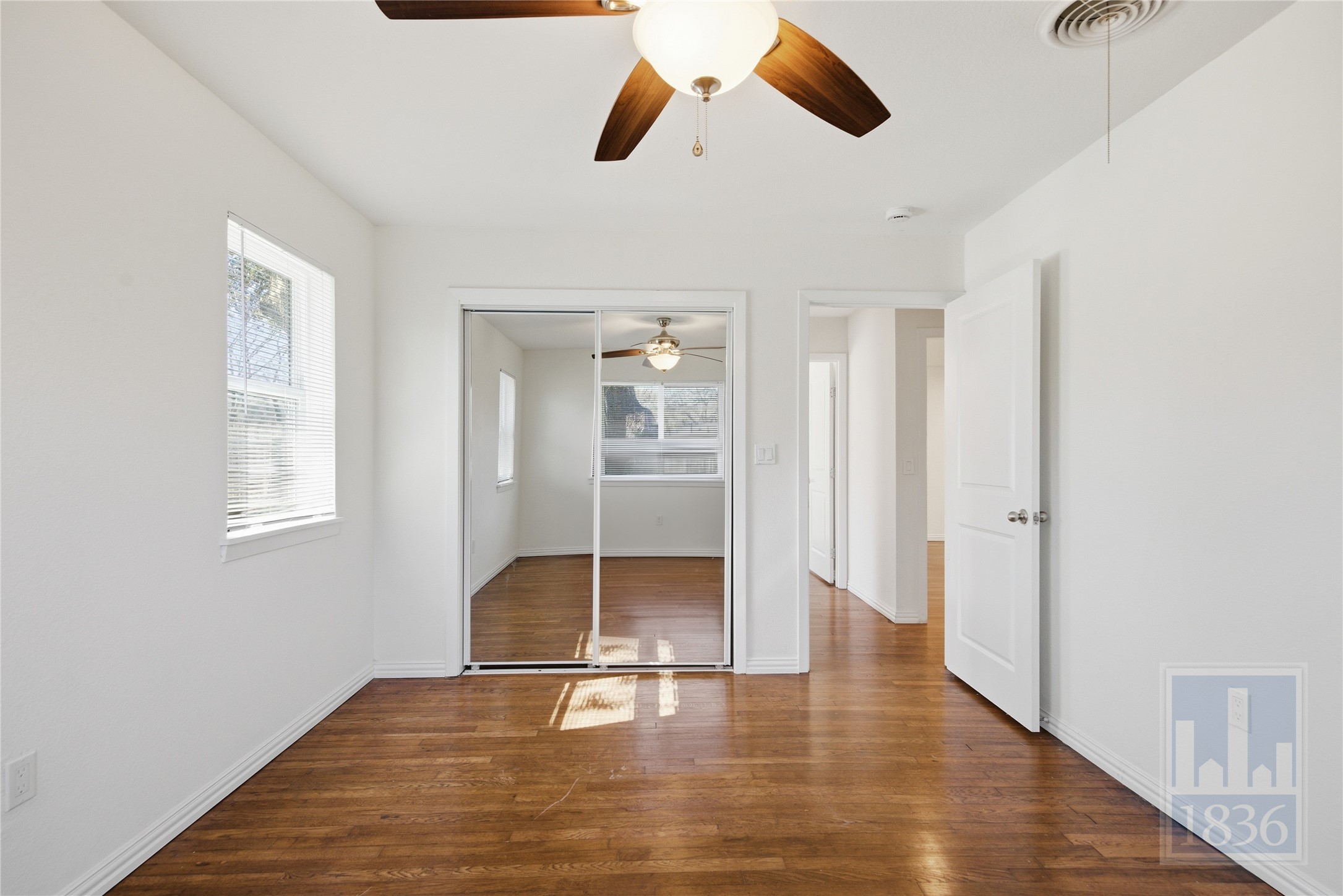 4405 Terrilance Drive Austin, TX 78741 - Photo 20 of 36 wooden floor in an empty room with a window