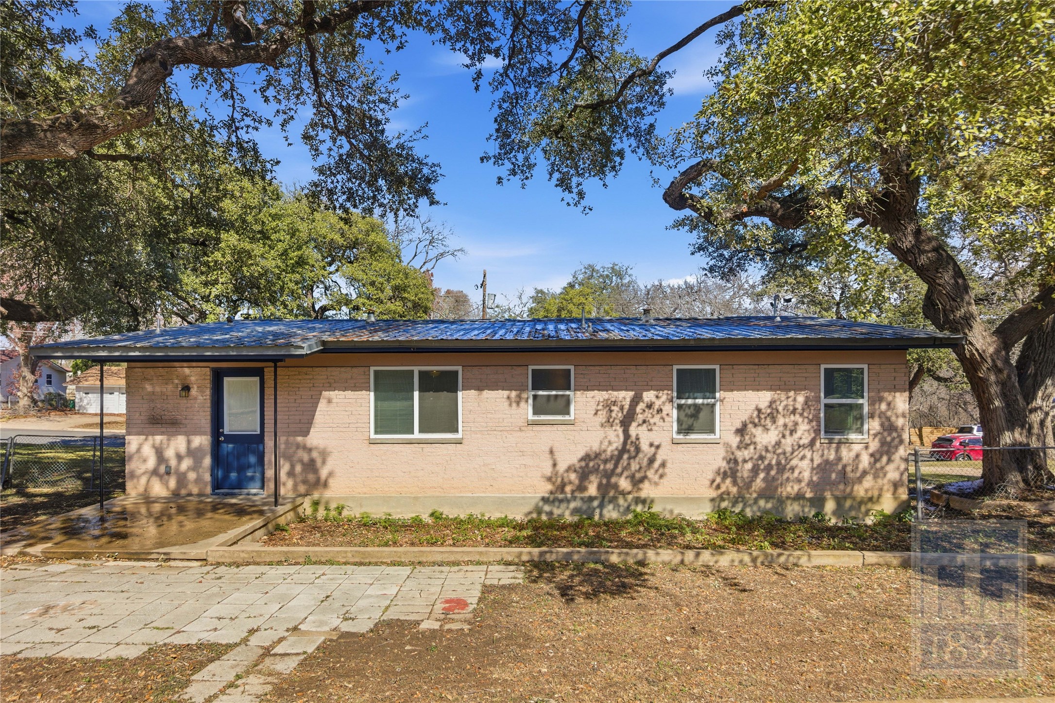 4405 Terrilance Drive Austin, TX 78741 - Photo 25 of 36 a front view of a house with garden