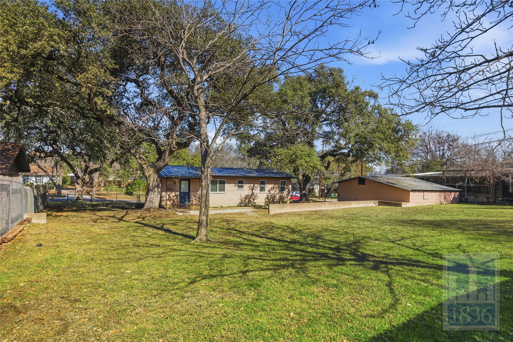 4405 Terrilance Drive Austin, TX 78741 - Photo 26 of 36 a front view of a house with a yard