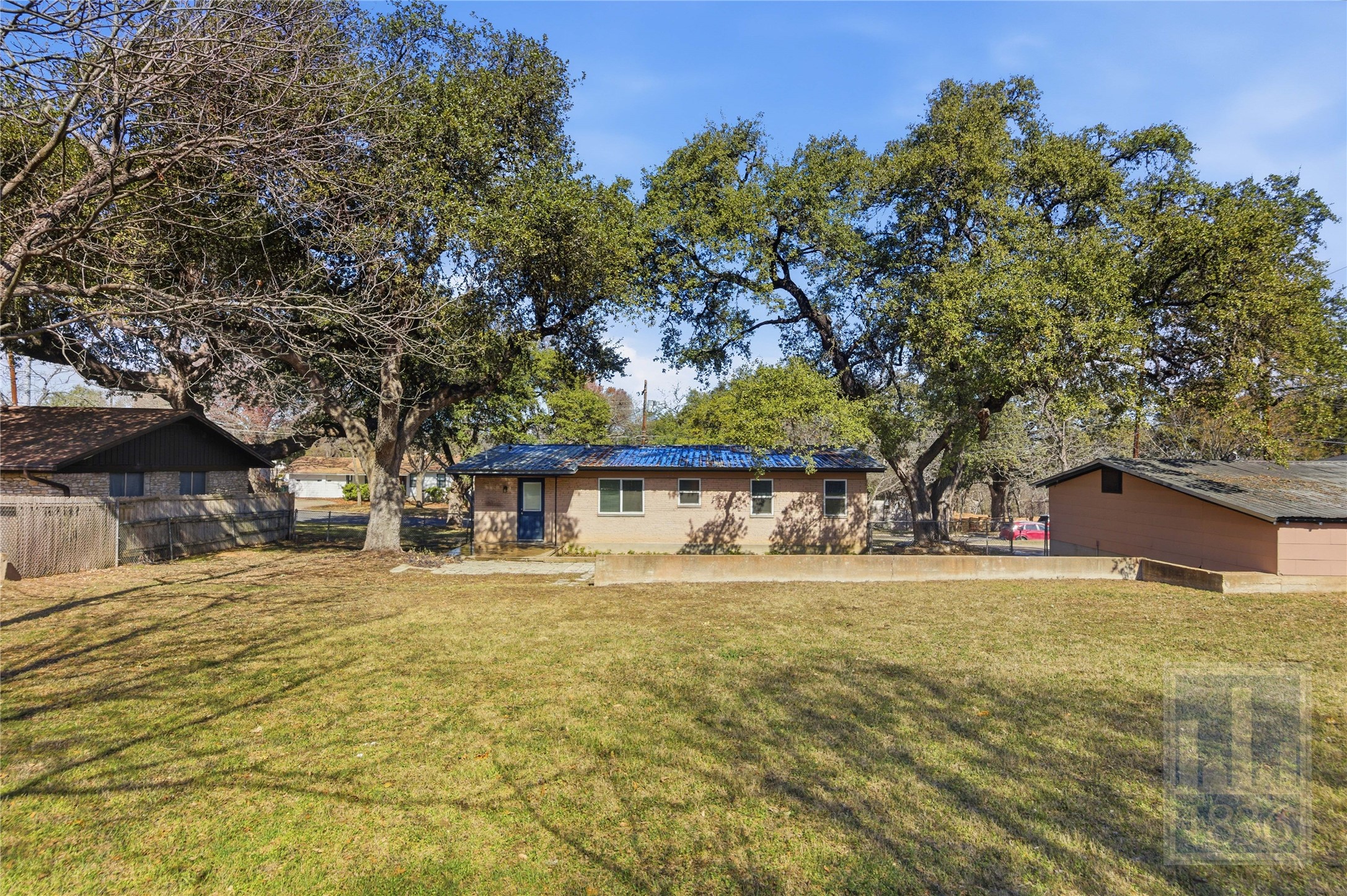 4405 Terrilance Drive Austin, TX 78741 - Photo 27 of 36 a front view of a house with a yard