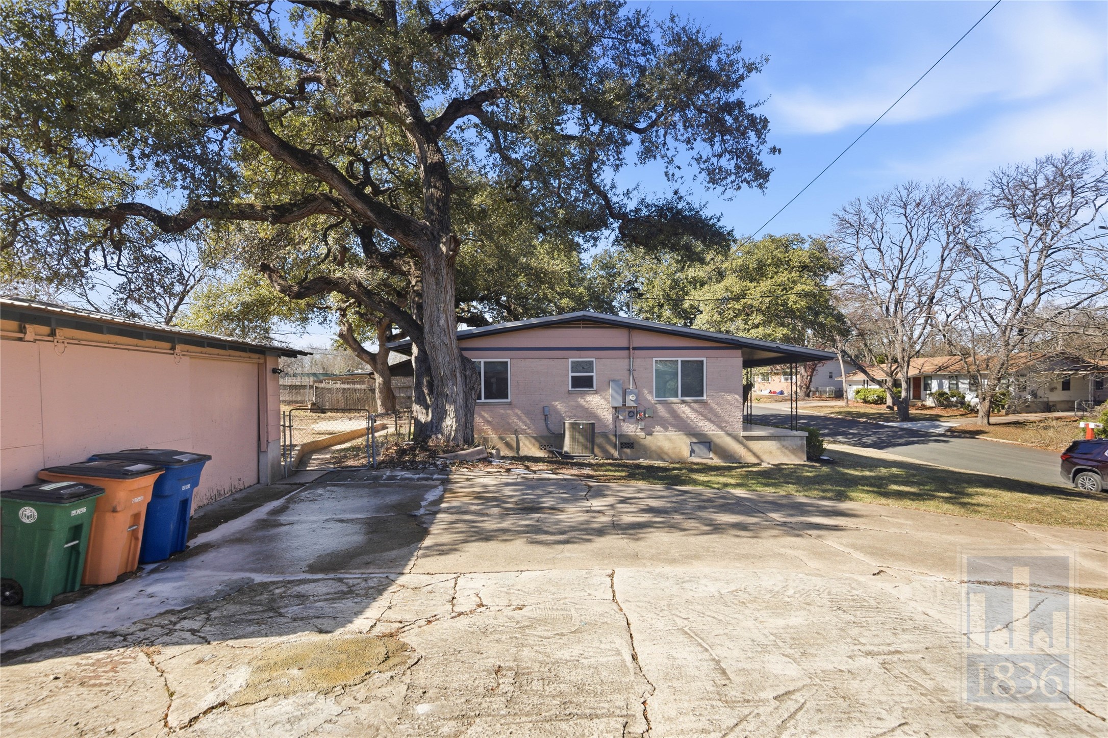 4405 Terrilance Drive Austin, TX 78741 - Photo 36 of 36 a view of a house with a yard covered in snow