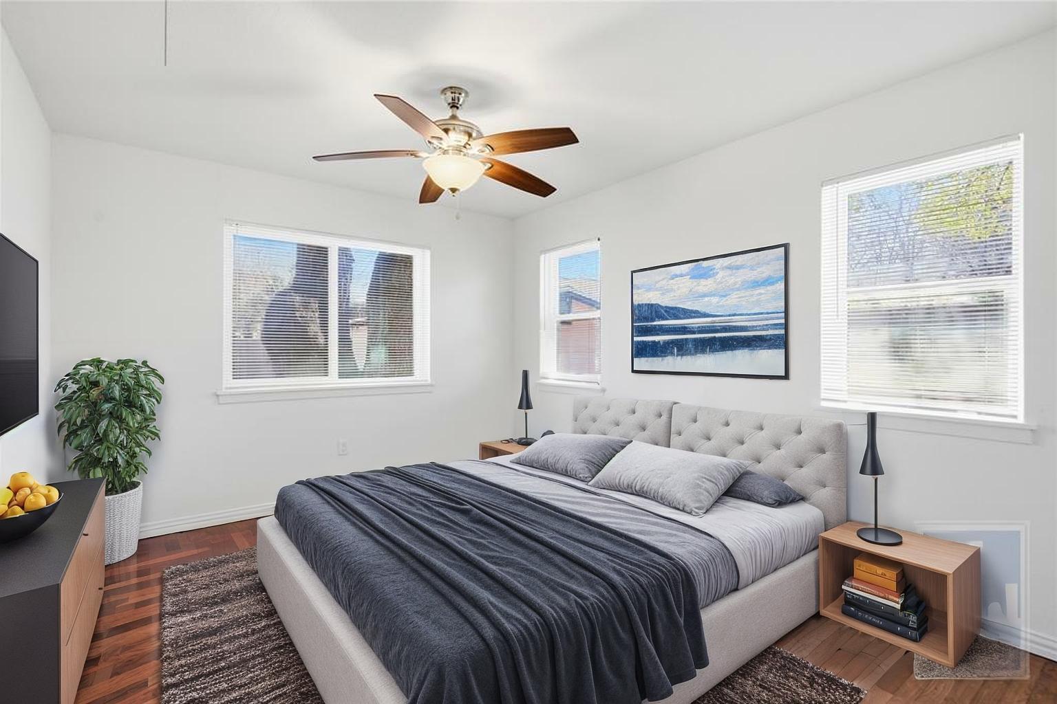 4405 Terrilance Drive Austin, TX 78741 - Photo 4 of 36 a bedroom with a large bed and a window