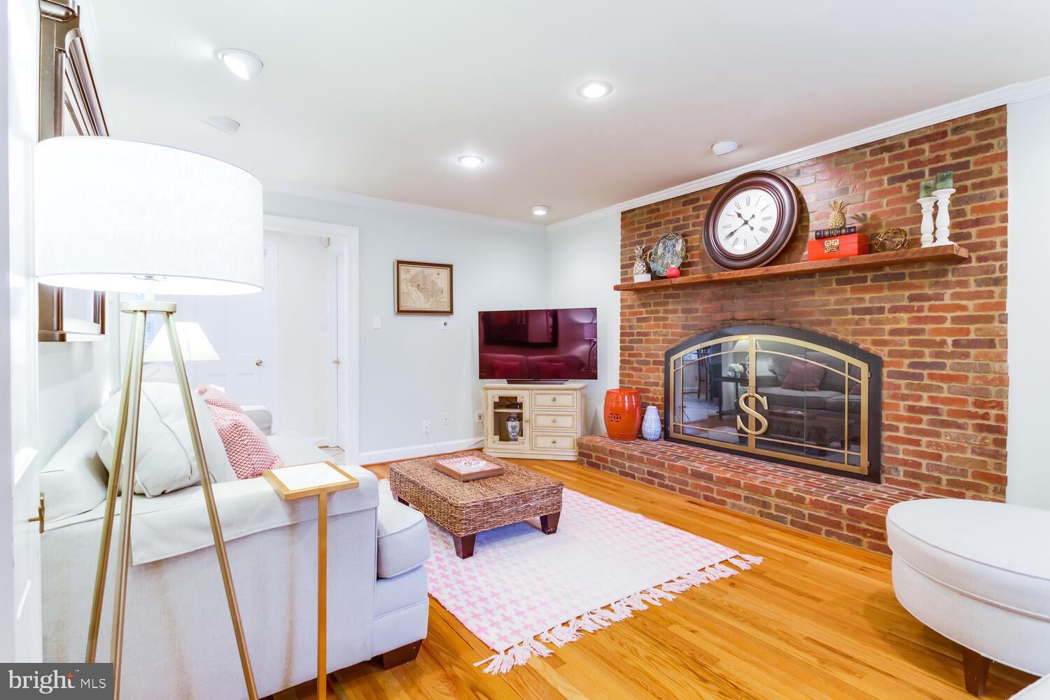1704 Stonebridge Road Alexandria, VA 22304 - Photo 14 of 52 a living room with furniture and a fireplace
