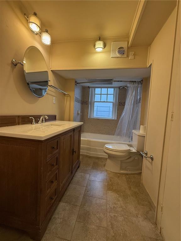 846 Briarcliff Road Northeast Atlanta, GA 30306 - Photo 20 of 22 a bathroom with a sink a toilet and mirror