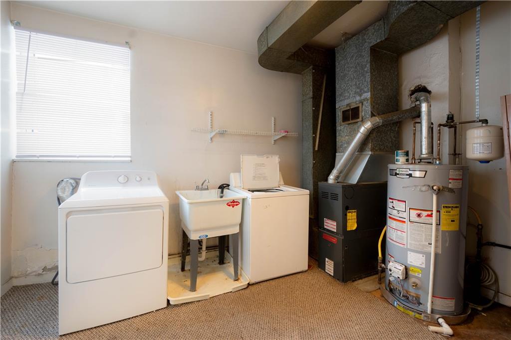 108 Pius Street Pittsburgh, PA 15203 - Photo 13 of 36 a utility room with dryer and washer