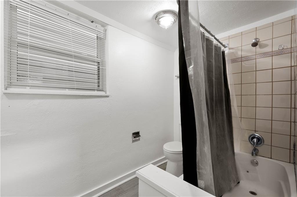 108 Pius Street Pittsburgh, PA 15203 - Photo 20 of 36 a bathroom with a sink a toilet and shower