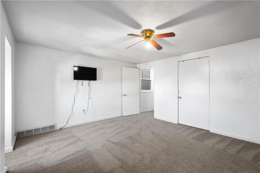 108 Pius Street Pittsburgh, PA 15203 - Photo 26 of 36 a view of an empty room with a ceiling fan