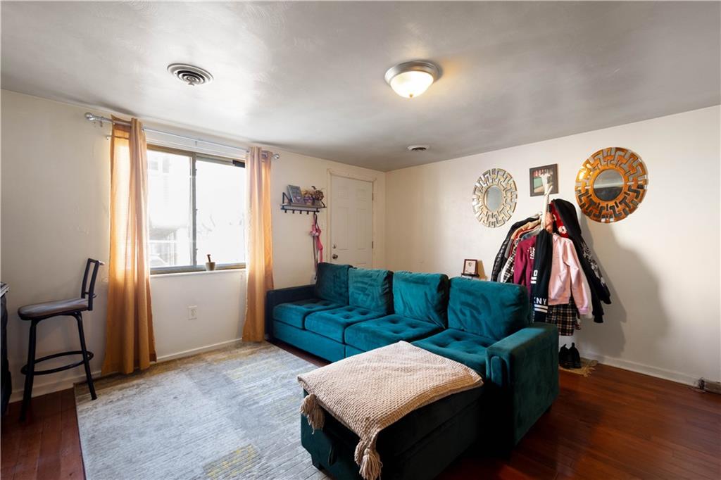 108 Pius Street Pittsburgh, PA 15203 - Photo 3 of 36 a living room with furniture and a window