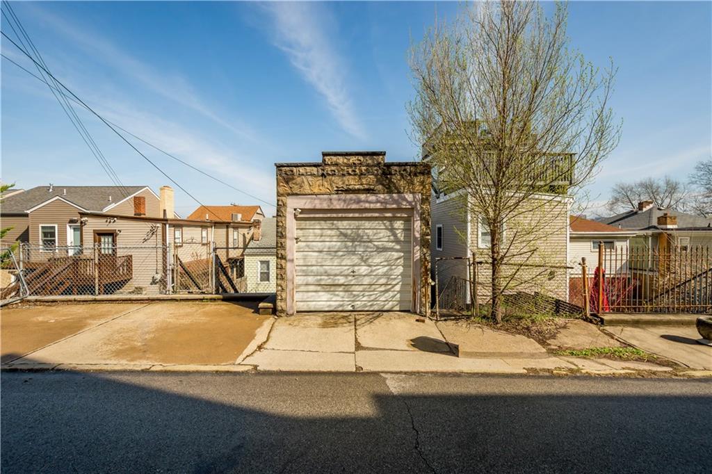 108 Pius Street Pittsburgh, PA 15203 - Photo 35 of 36 a view of a house with a snow in the yard