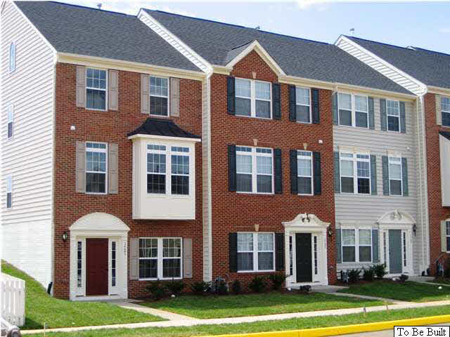 417 Rolkin Road Charlottesville, VA 22911 - Photo 1 of 22 a front view of a residential apartment building with a yard
