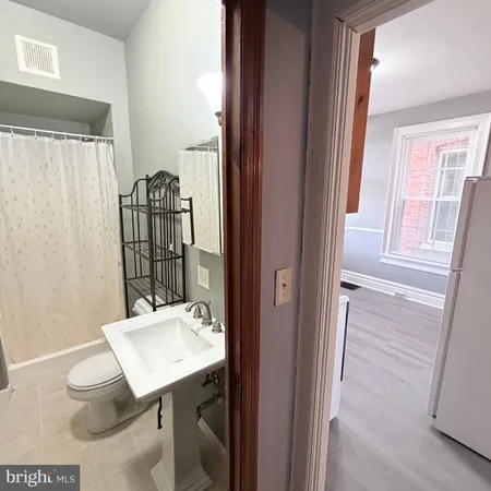 a view of a room with furniture and window