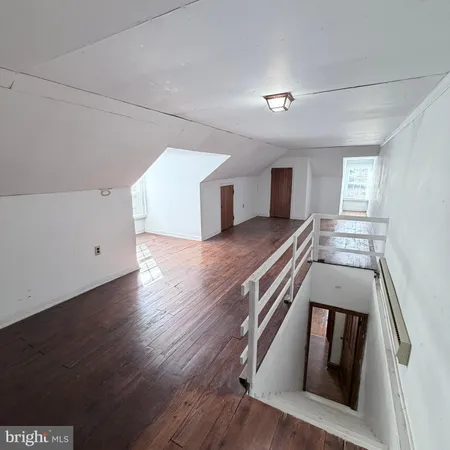 a view of a livingroom with wooden floor