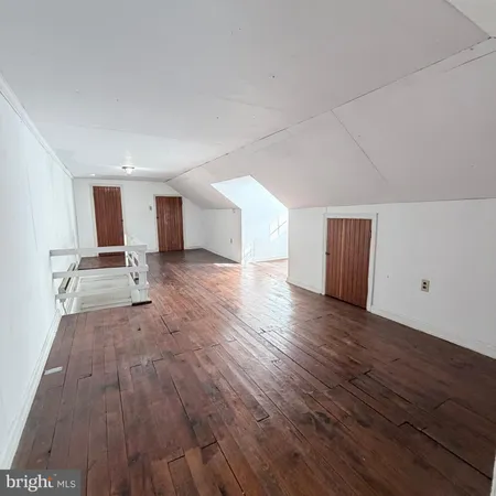 a view of a brick house with many windows